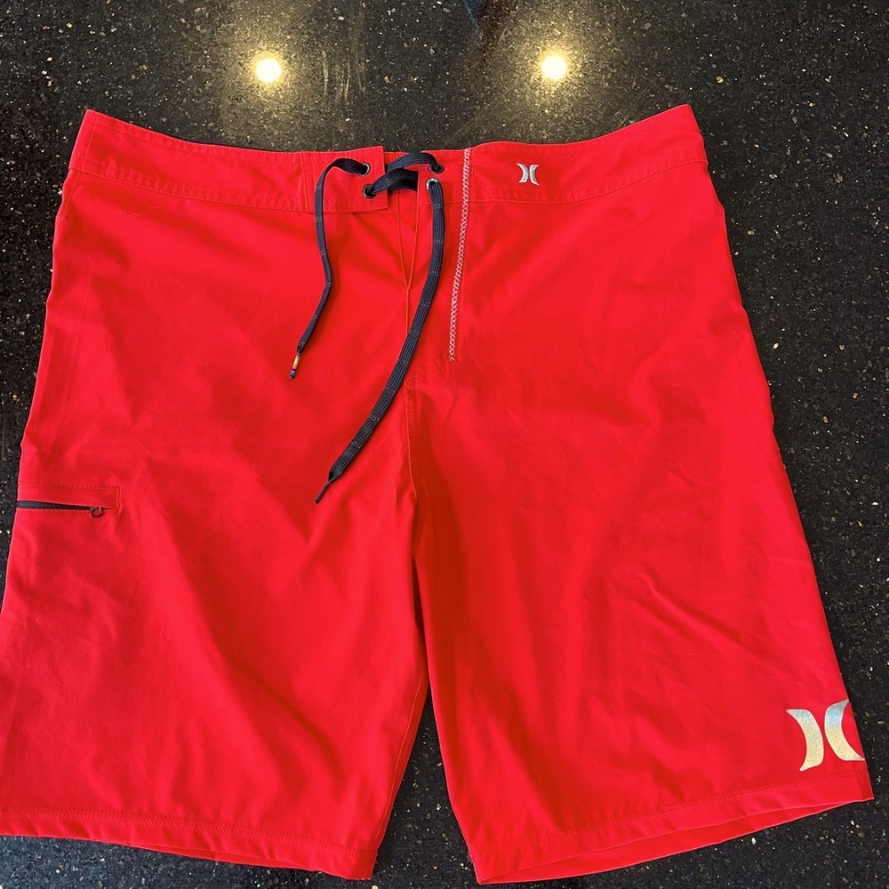 Men’s Hurley Phantom board shorts, worn once. 10” inseam. Red. Great condition.